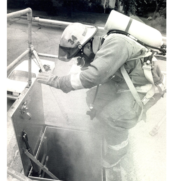 1987: Mifflin Township Firefighter Robert Dickson climbs through the roof of a training maze to test the department's new self-contained breathing apparatus. The equipment consists of a face mask and compressed air tank that allows firefighters to breathe in smoke- or chemical-filled conditions. | Dispatch file photo