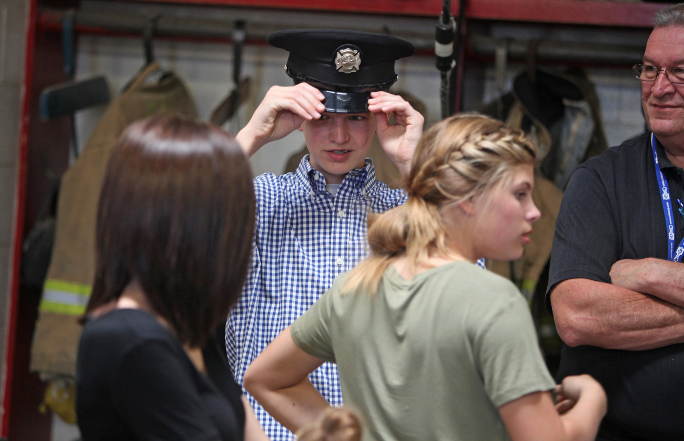Cohen Rine wears his father's firefighting hat after Columbus firefighter Mark Rine was named Firefighter of the Month